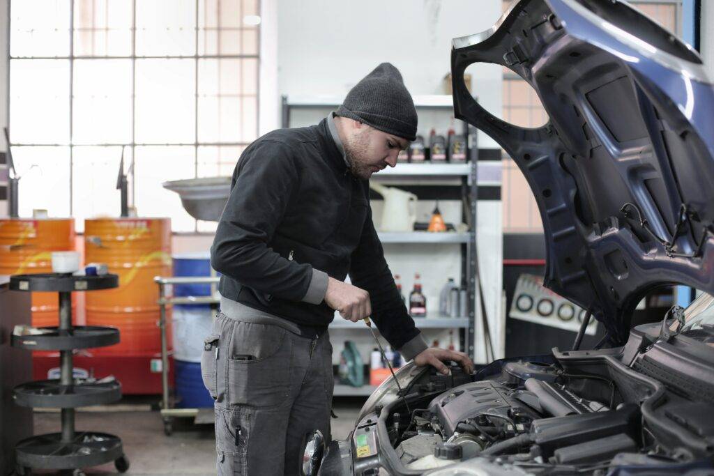Mechanic working on a car engine